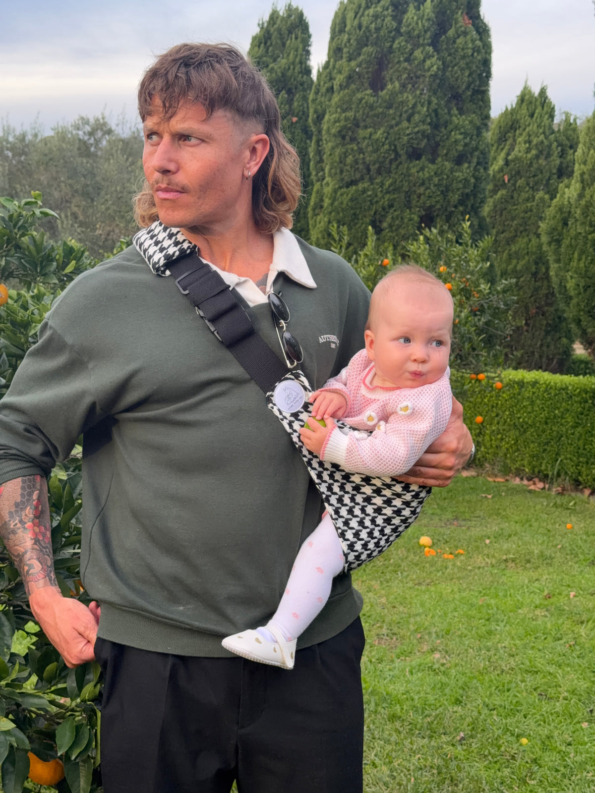 Salt & Pepper | Dad carrying baby outside with tree's and oranges